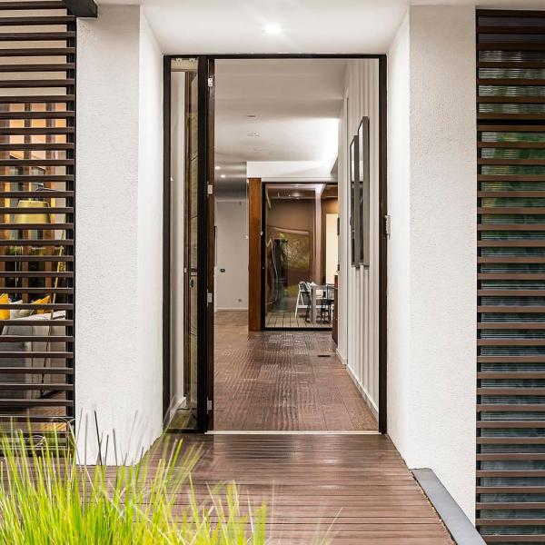 modern-house-exterior-with-open-door-and-deck-2026-03-09-03-26-52-utc